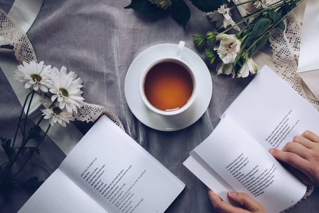 coffee cup and poetry books